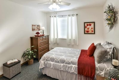 Cozy private room with a bed and decorative elements