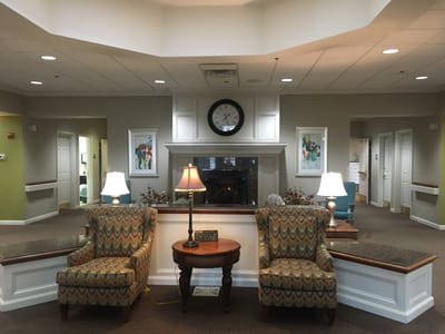 Cozy common area with chairs and a lamp