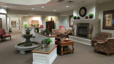 Common area in a senior living facility with seating and decor