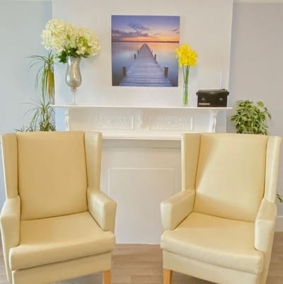 A cozy common area with chairs and decor