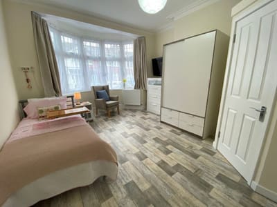 A comfortable private resident room with natural light