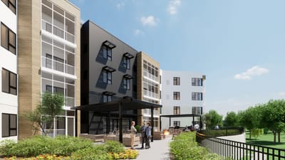 Residents socializing in an outdoor area with seating