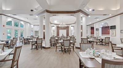 Bright and spacious dining room with tables