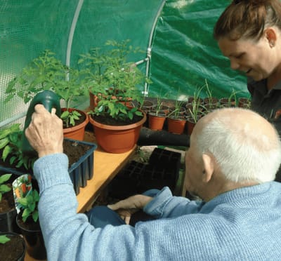 Residents engaging in gardening activity