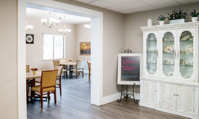 Interior view of a dining area with tables and chairs