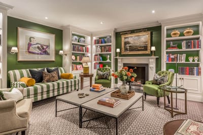 Cozy common area with comfortable seating and bookshelves