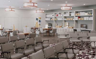 Bright activity room with tables and chairs