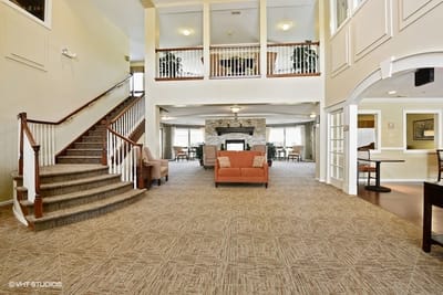 Interior view of a large common area with a fireplace and seating