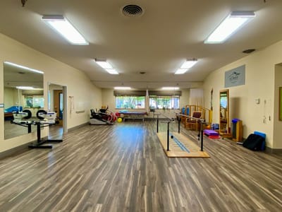 Well-equipped therapy room with exercise equipment
