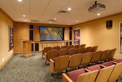 A cozy movie screening room with plush seating