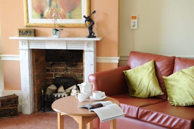 Cozy common area with couch and coffee set