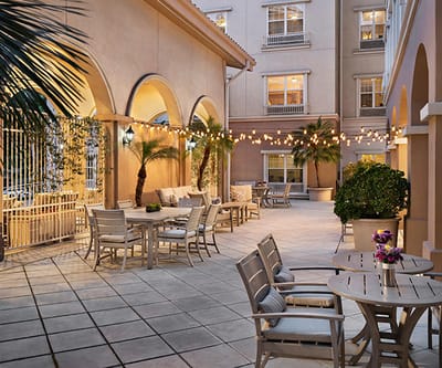 Outdoor patio area with seating and decorative lighting