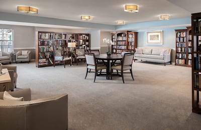 Interior common area with bookshelves and seating