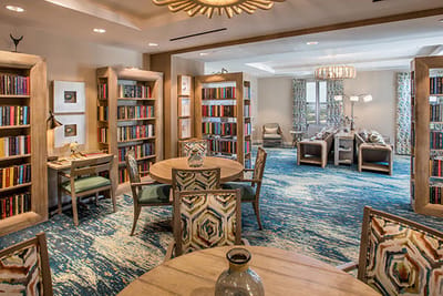 Interior view of a cozy common area with bookshelves