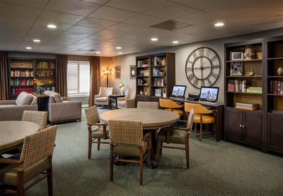 Bright common area with seating and bookshelves