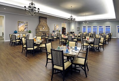 Well-decorated dining room with tables set for meals