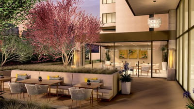 Outdoor seating area with vibrant landscaping
