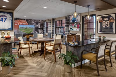 Common area with seating and sports memorabilia