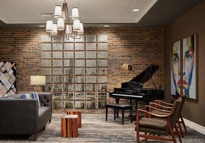 Interior of a cozy common area with a piano