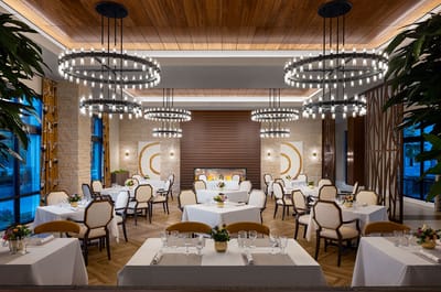 Elegant dining room with round tables and chandeliers