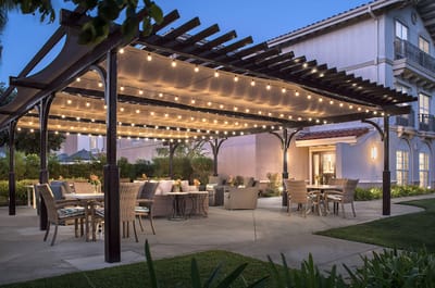 Outdoor patio area with string lights and seating