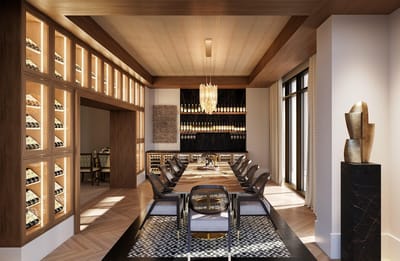 Elegant dining room with a large table and wine display