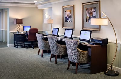 Interior computer area with seating and artwork