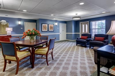 Interior common area with seating and decorative flowers