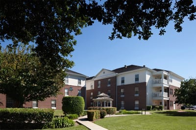 Exterior view of Belmont Village with outdoor gazebo