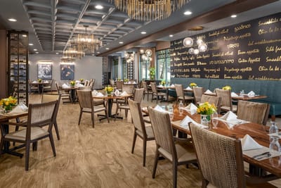 Elegant dining room with tables set for meals