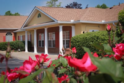 Exterior view of the facility with blooming roses