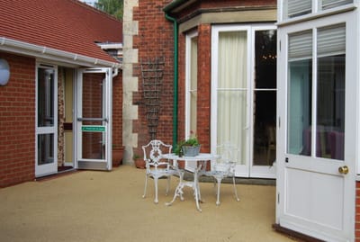 Outdoor seating area with chairs and a small table