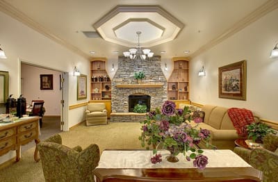 Interior common area with cozy seating and a fireplace