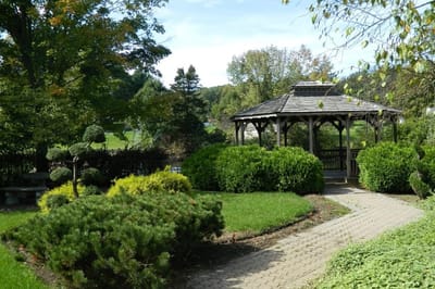 Beautiful garden with gazebo and manicured greenery