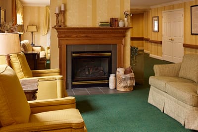 Cozy common area with seating and a fireplace