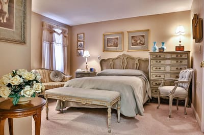 Cozy interior of a resident's bedroom with elegant furniture