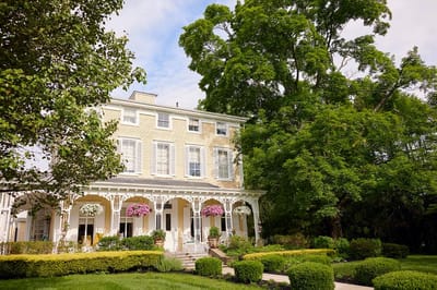 Brandywine Signature Haddonfield, assisted living in Haddonfield, NJ — Historic building surrounded by lush greenery and gardens