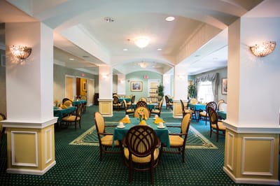 Bright dining room with tables set for meals