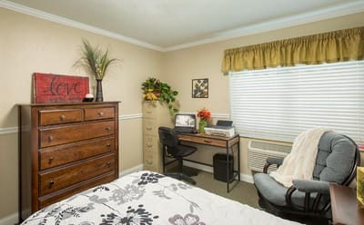 Cozy, well-decorated resident room with furniture