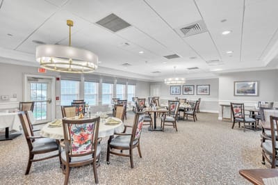 Bright dining room with tables and floral decorations