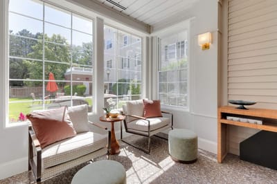 Bright sunlit lounge area with view of outdoor garden