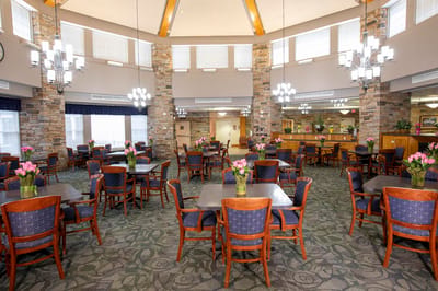 Dining room area with tables and flowers