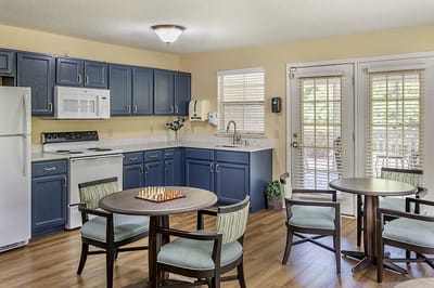 Bright common area with kitchenette and seating