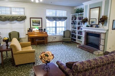 Cozy common area with seating and a piano