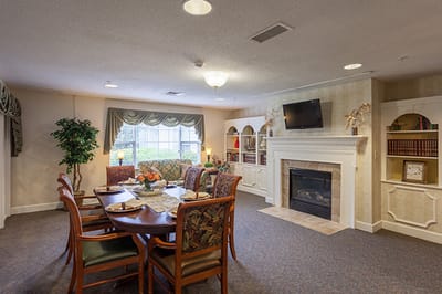 Common area with a dining table and fireplace