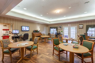 Bright common area with tables and chairs
