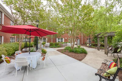 Outdoor seating area with tables and umbrellas