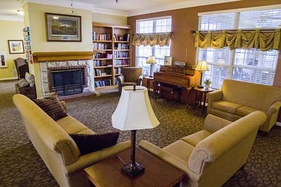 Cozy common area with seating and bookshelves
