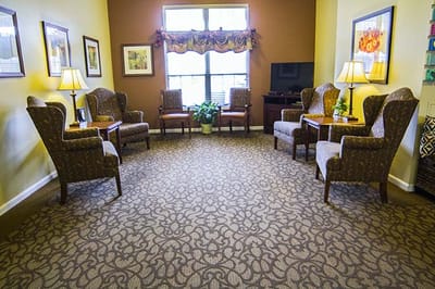 Cozy common area with chairs and lamps
