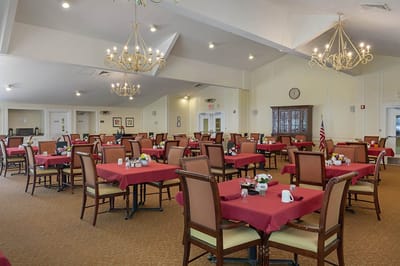 Dining room with tables set for residents